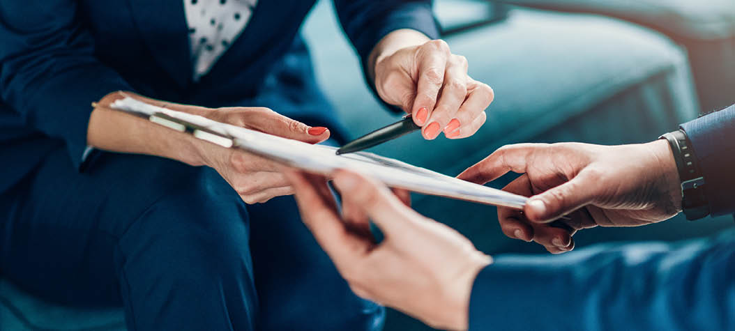 Close up of a business persons analyzing important documents